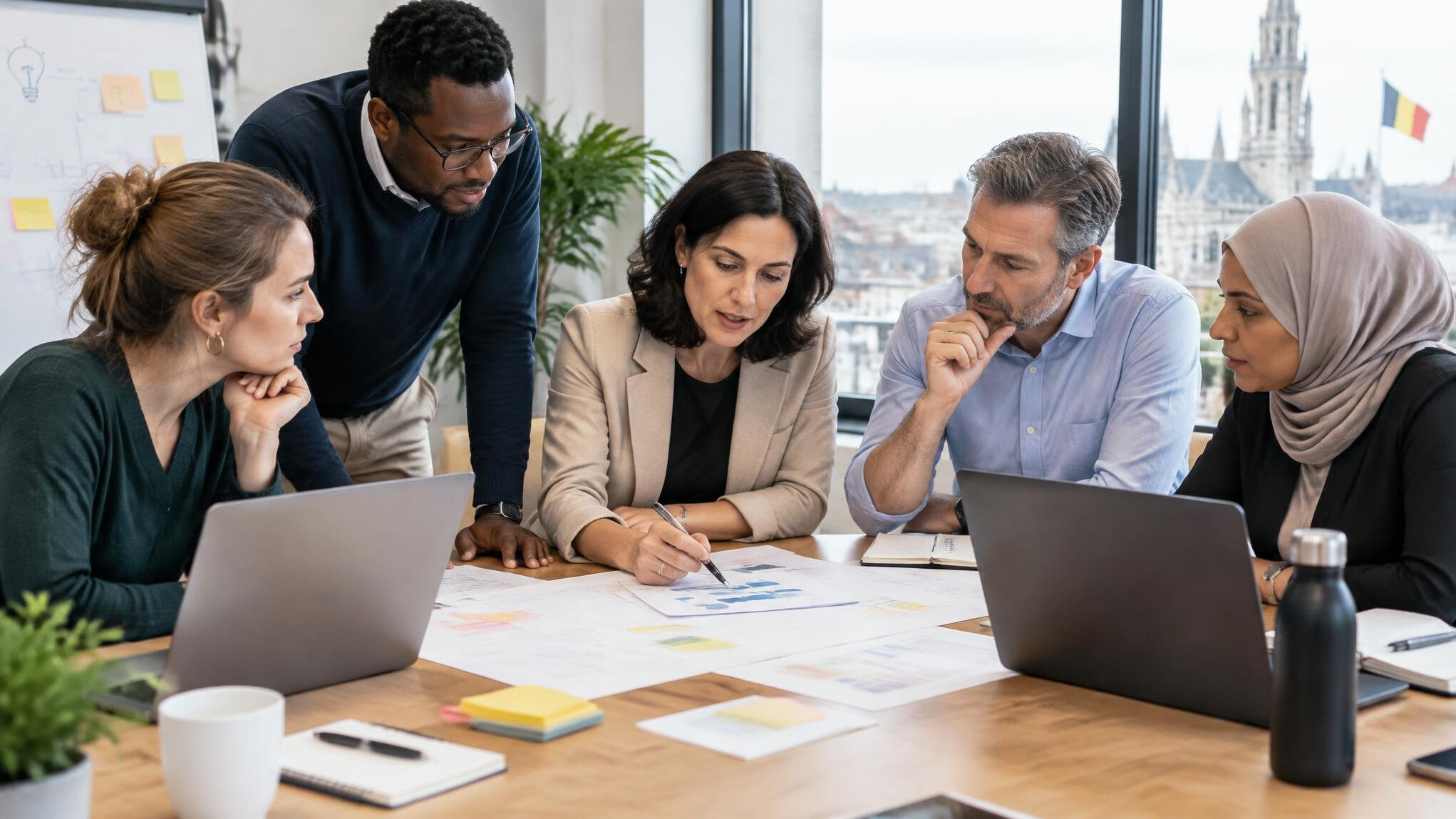 Team gathered around a table during a workplace planning session